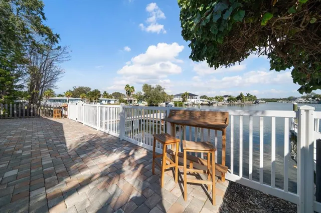 a view of a swimming pool with a lounge chair