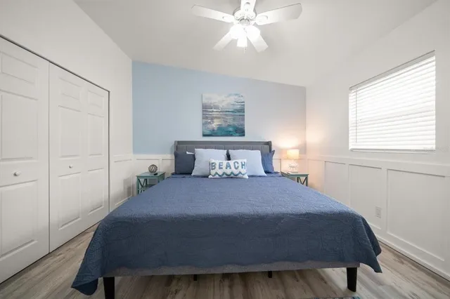 a bedroom with a bed and window