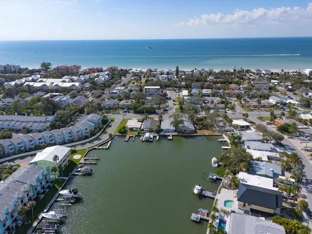 an aerial view of a house with a lake view