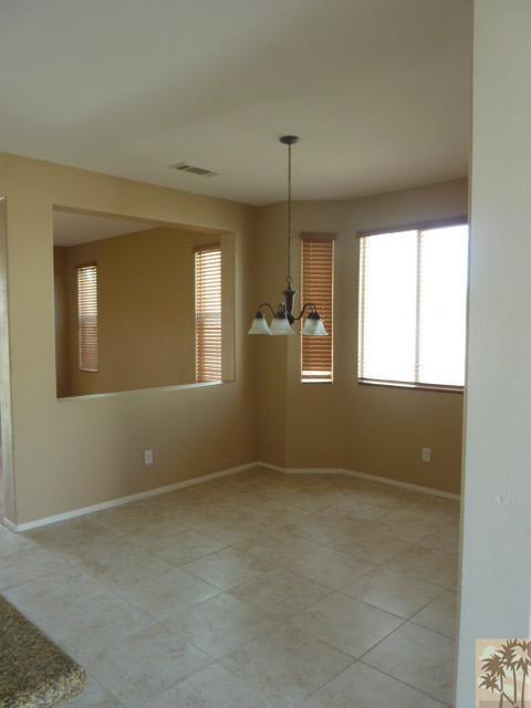 37185 Wakefield Street Indio, CA 92203 - Photo 5 of 8 a view of an empty room with a window