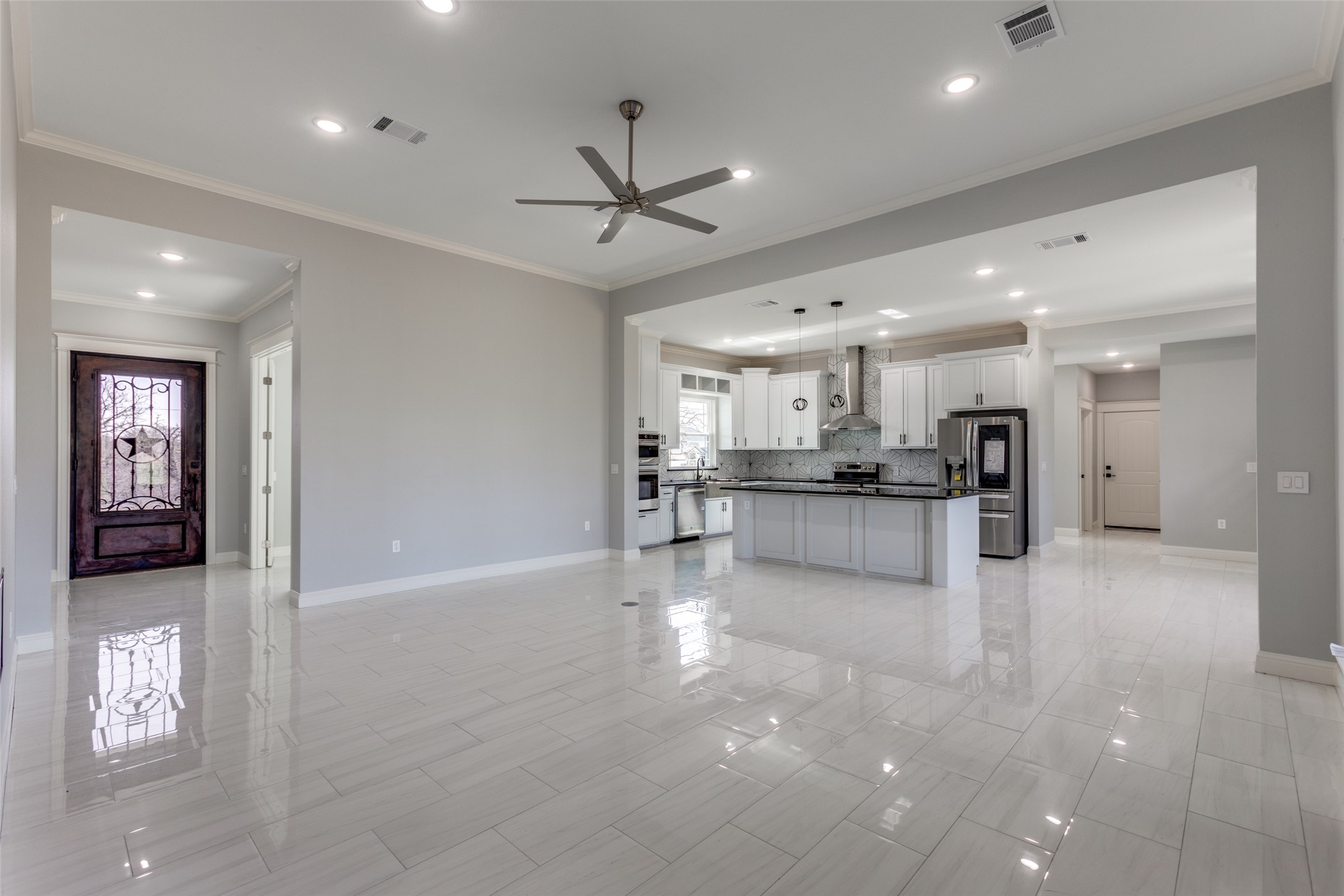 485 Post Oak Gonzales, TX 78629 - Photo 11 of 38 a view of kitchen with kitchen island stainless steel appliances refrigerator oven and cabinets