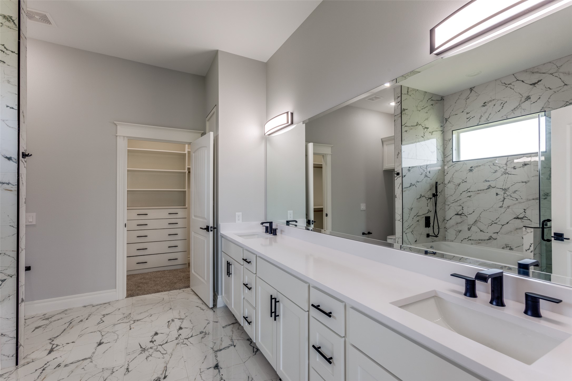 485 Post Oak Gonzales, TX 78629 - Photo 16 of 38 a bathroom with double vanity sink and a mirror