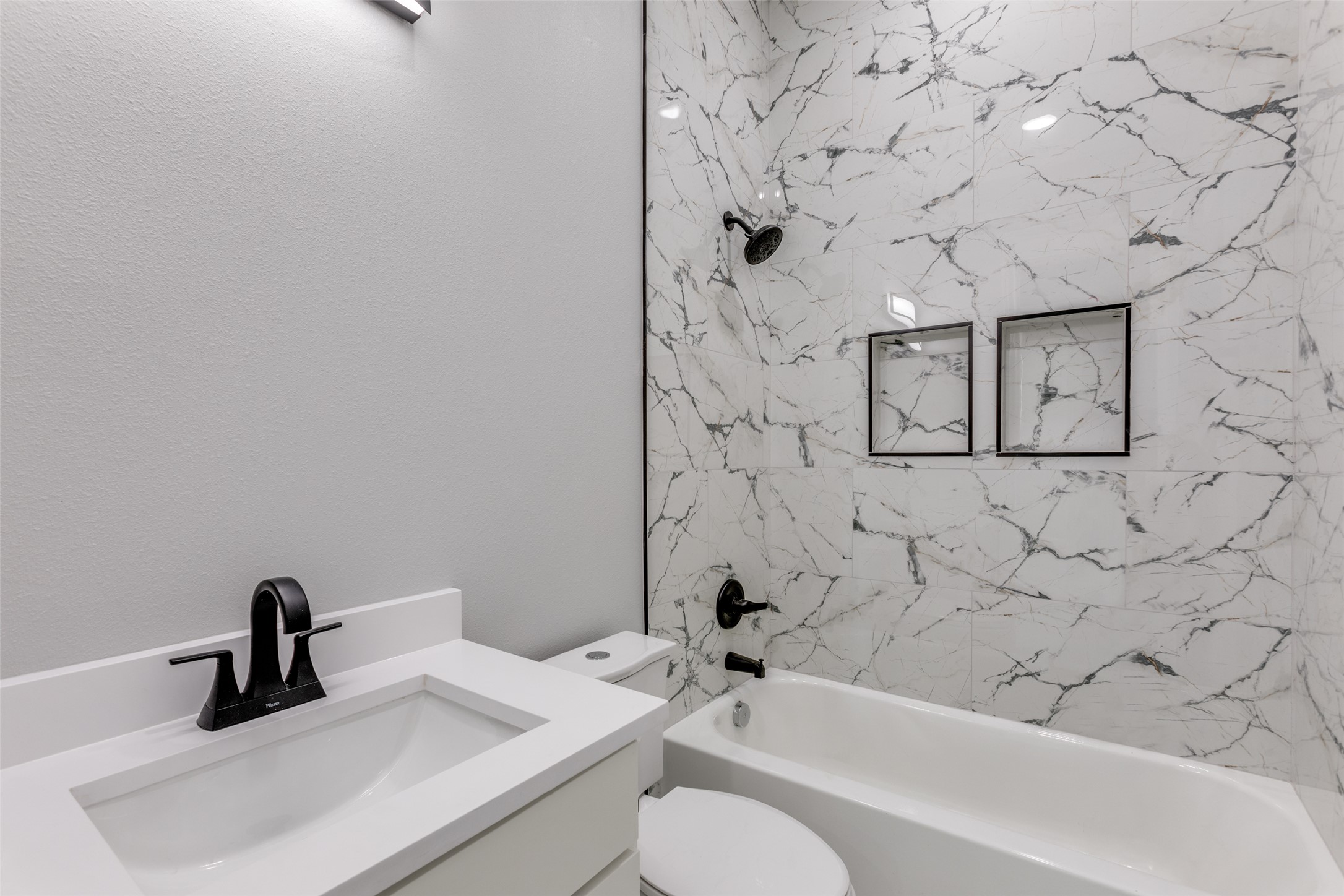 485 Post Oak Gonzales, TX 78629 - Photo 19 of 38 a bathroom with a sink toilet and shower