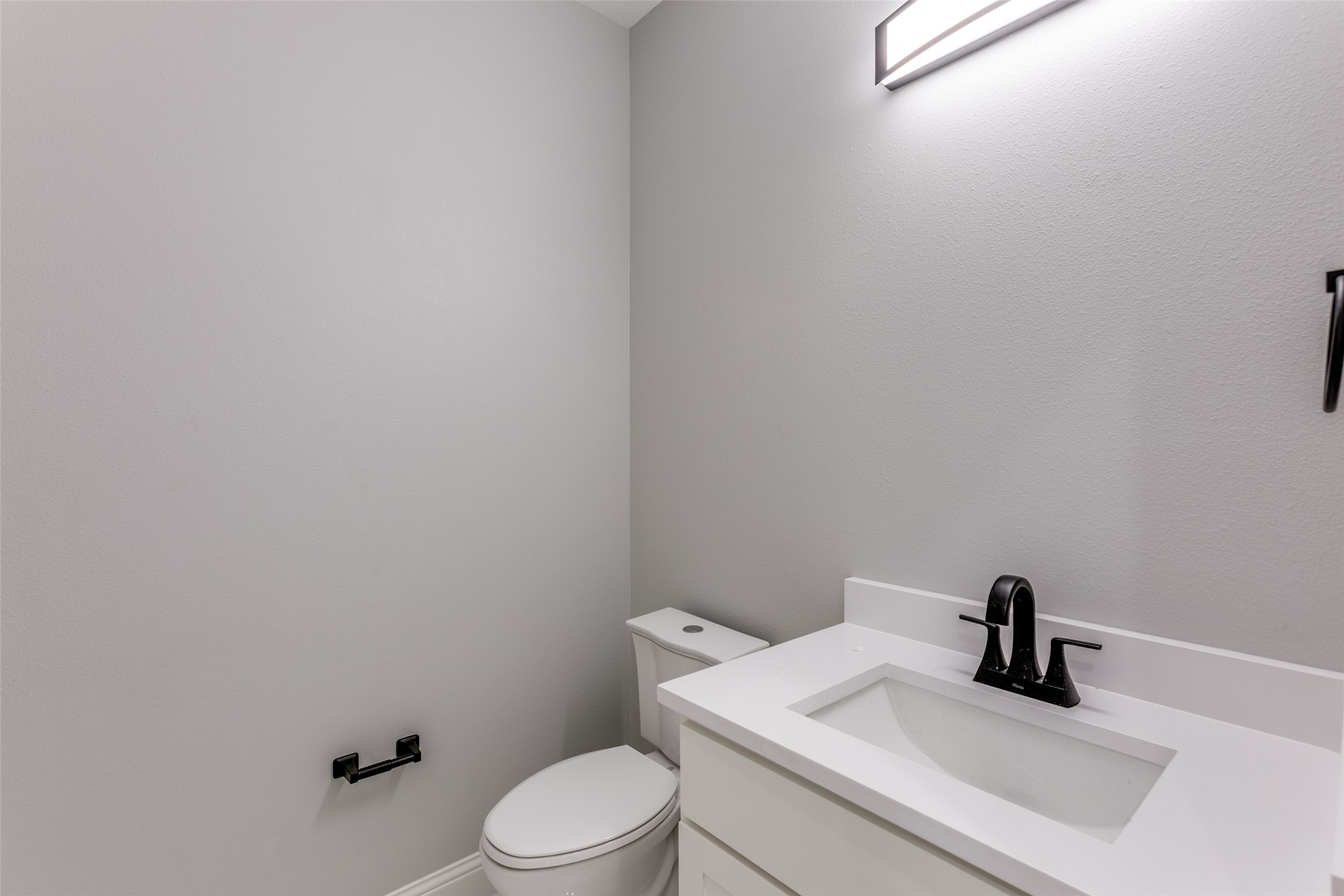 485 Post Oak Gonzales, TX 78629 - Photo 22 of 38 a bathroom with a sink a toilet and mirror