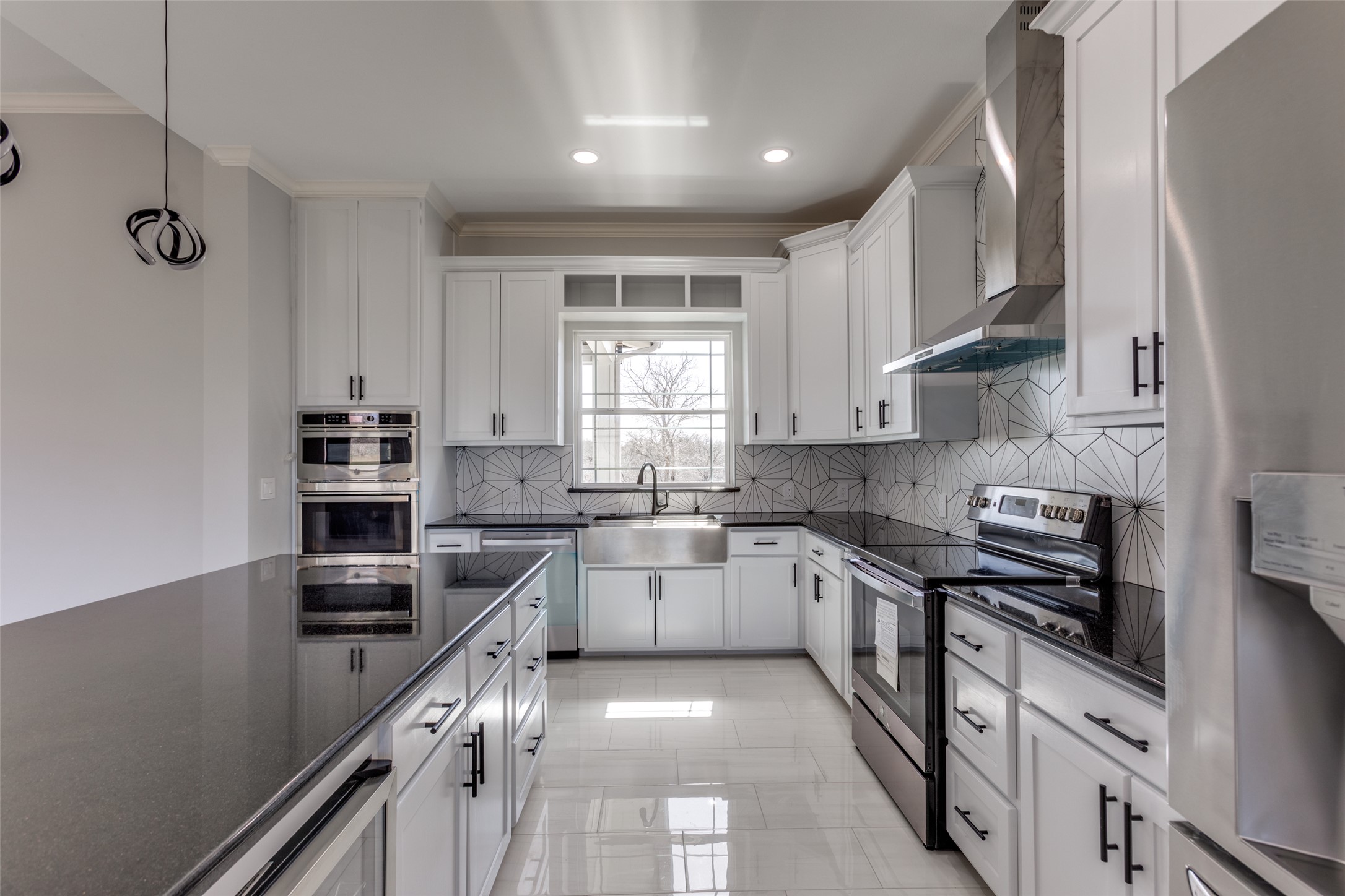 485 Post Oak Gonzales, TX 78629 - Photo 4 of 38 a kitchen with stainless steel appliances granite countertop a sink stove cabinets and a refrigerator