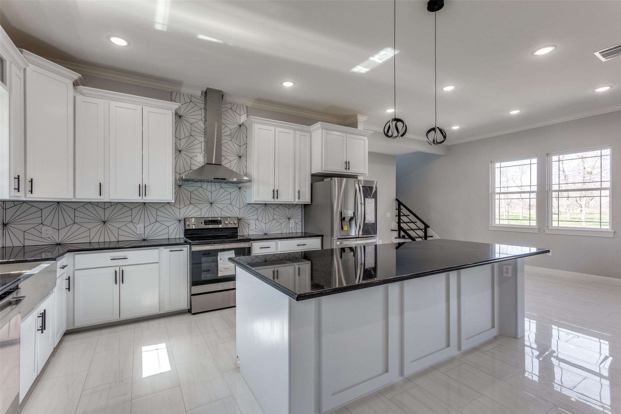 485 Post Oak Gonzales, TX 78629 - Photo 6 of 38 a kitchen with kitchen island granite countertop a sink a stove and cabinets