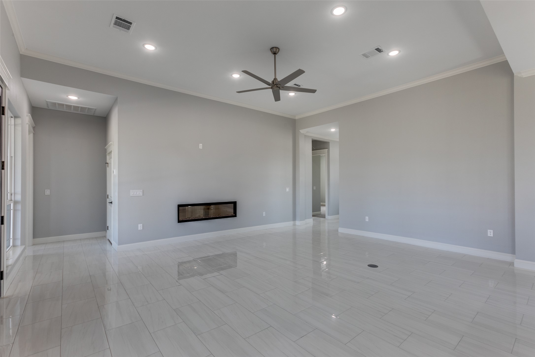 485 Post Oak Gonzales, TX 78629 - Photo 8 of 38 an empty room with a empty space and a ceiling fan