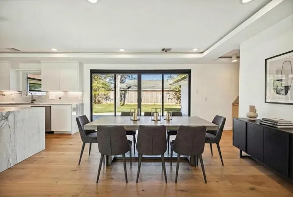 a view of an house with backyard space and garden