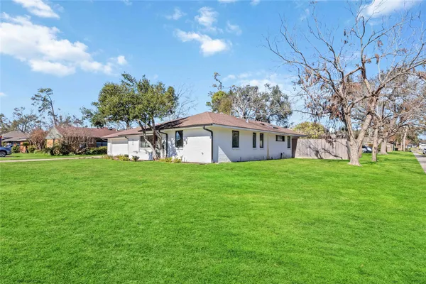 a view of a house with a big yard