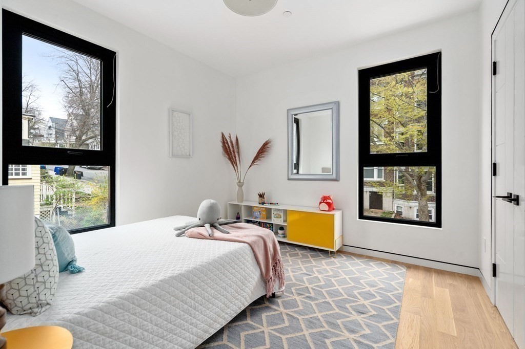 41 Stearns Road, Unit SF Brookline, MA 02446 - Photo 14 of 26 a bedroom with a bed and a window