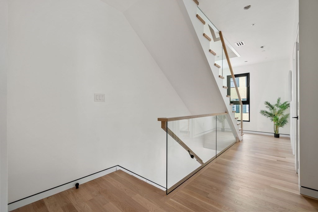 41 Stearns Road, Unit SF Brookline, MA 02446 - Photo 18 of 26 a view of an entryway with wooden floor