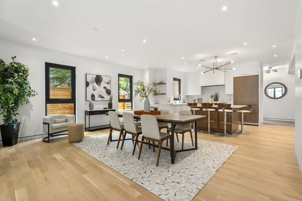 41 Stearns Road, Unit SF Brookline, MA 02446 - Photo 2 of 26 a living room with stainless steel appliances furniture a dining table and kitchen view