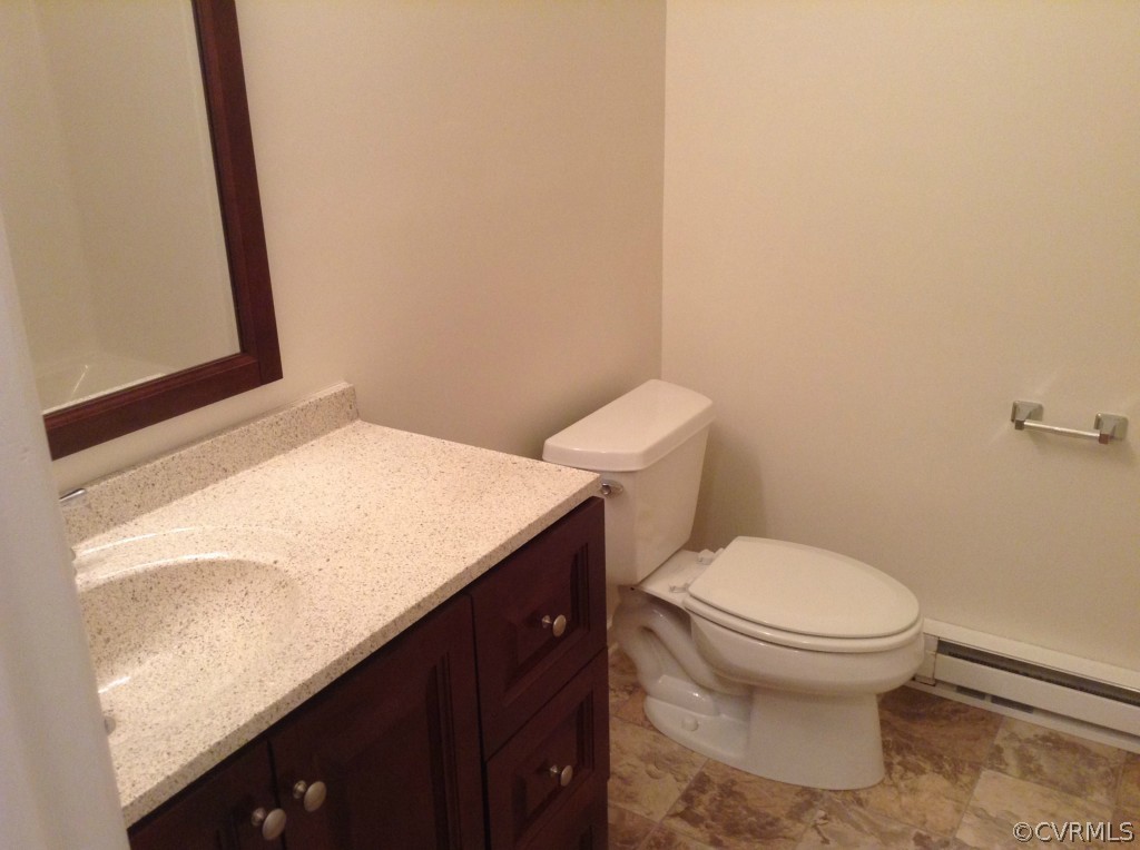 9513 Beach Road Chesterfield, VA 23838 - Photo 11 of 14 a bathroom with a sink and a toilet