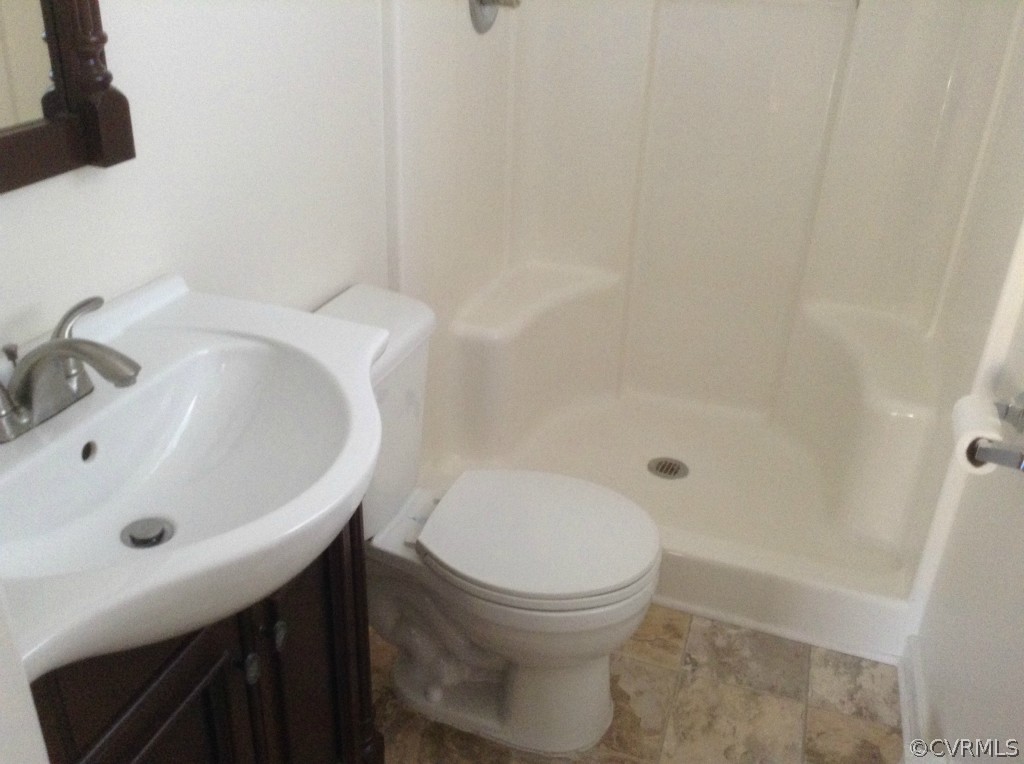 9513 Beach Road Chesterfield, VA 23838 - Photo 12 of 14 a bathroom with a sink and a toilet