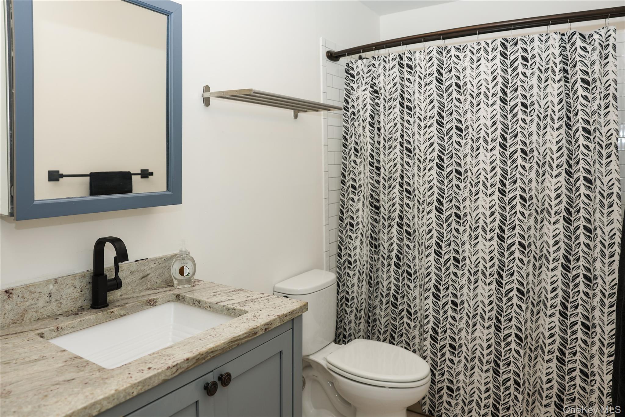 3675 Old Yorktown Road, Unit 13 Shrub Oak, NY 10588 - Photo 12 of 26 a bathroom with a granite countertop sink a toilet and a mirror
