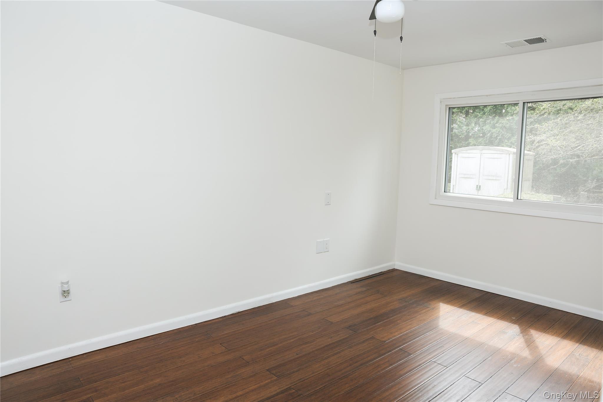 3675 Old Yorktown Road, Unit 13 Shrub Oak, NY 10588 - Photo 14 of 26 an empty room with wooden floor and windows