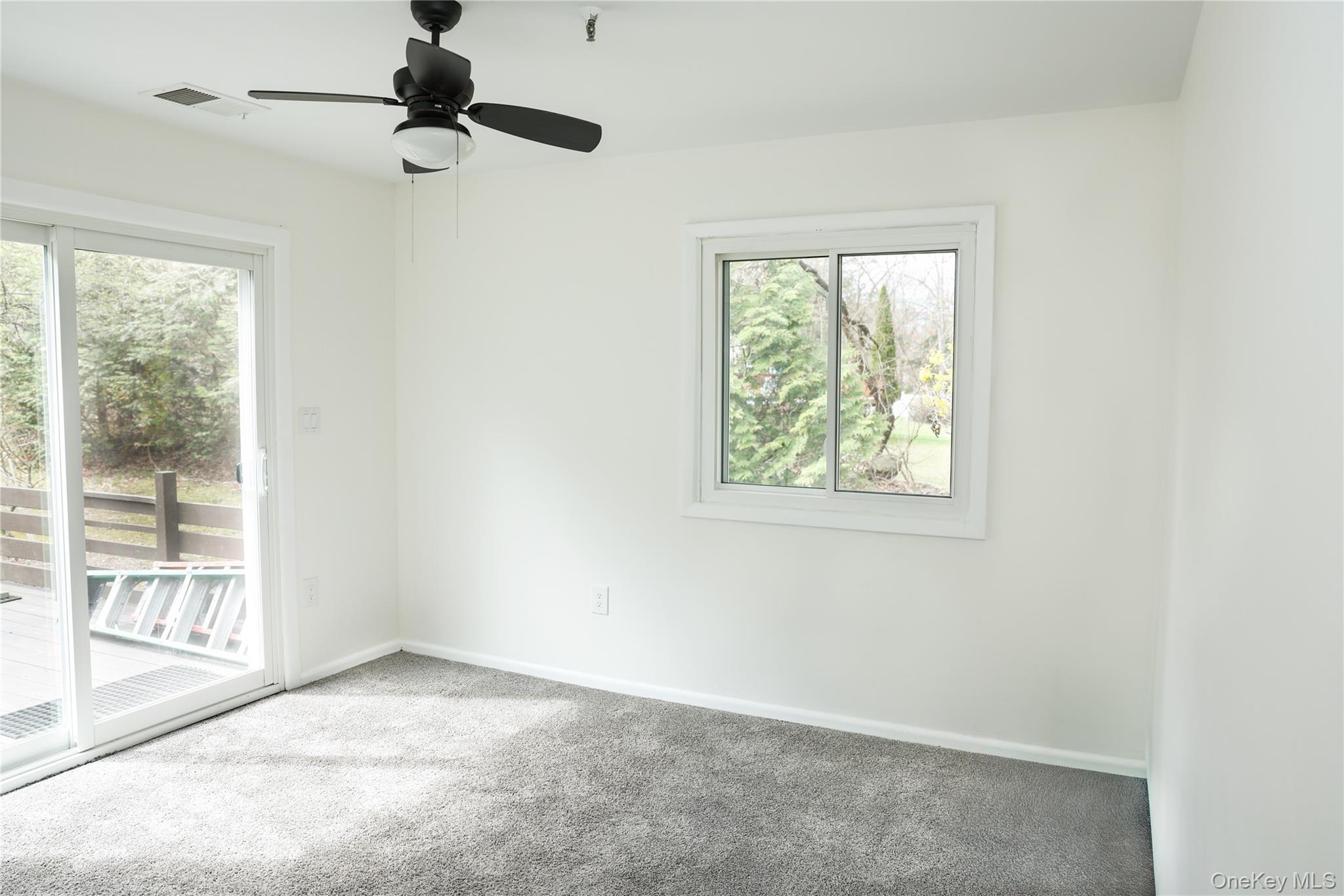3675 Old Yorktown Road, Unit 13 Shrub Oak, NY 10588 - Photo 18 of 26 an empty room with windows