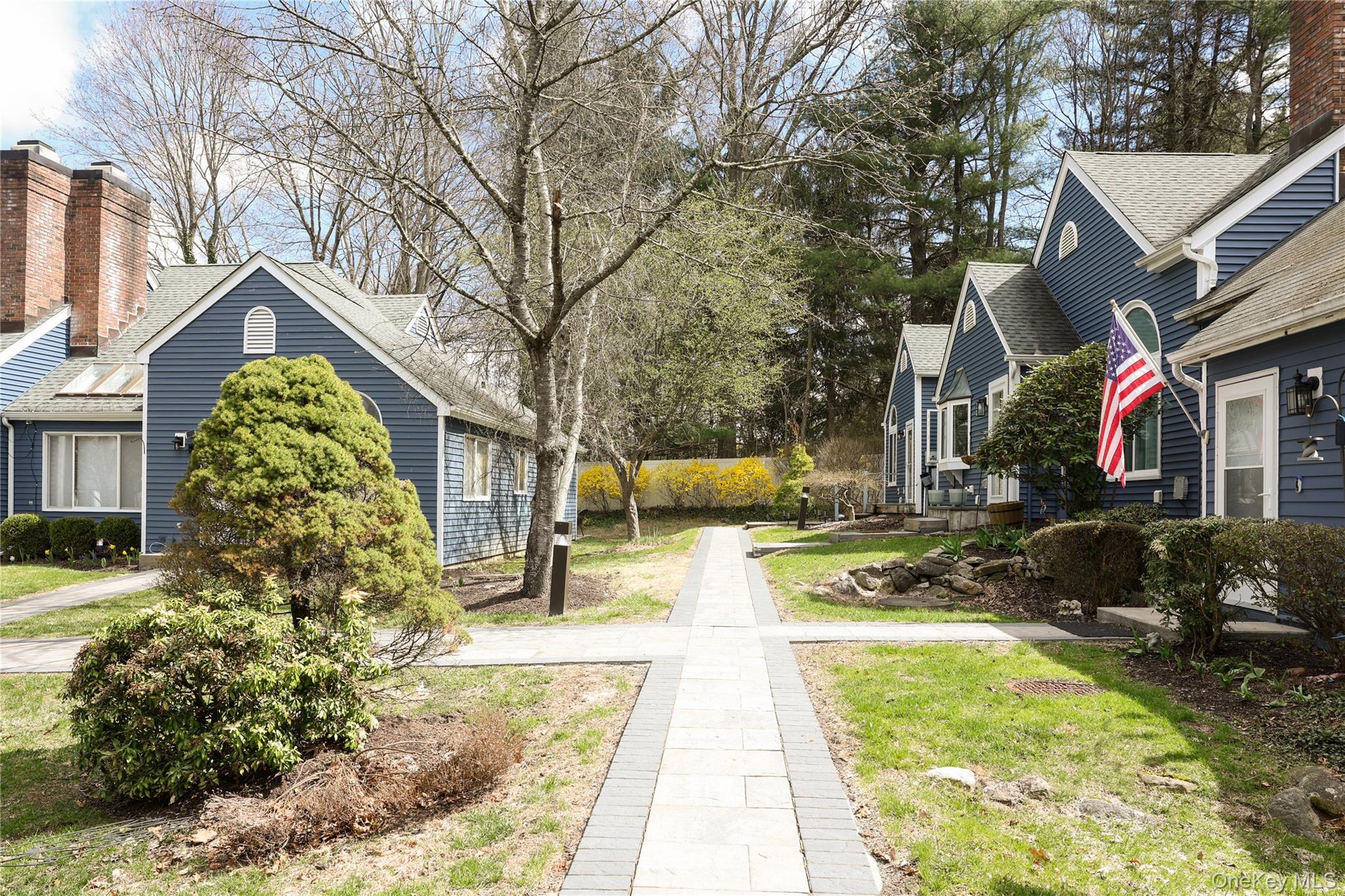 3675 Old Yorktown Road, Unit 13 Shrub Oak, NY 10588 - Photo 2 of 26 a front view of a house with garden