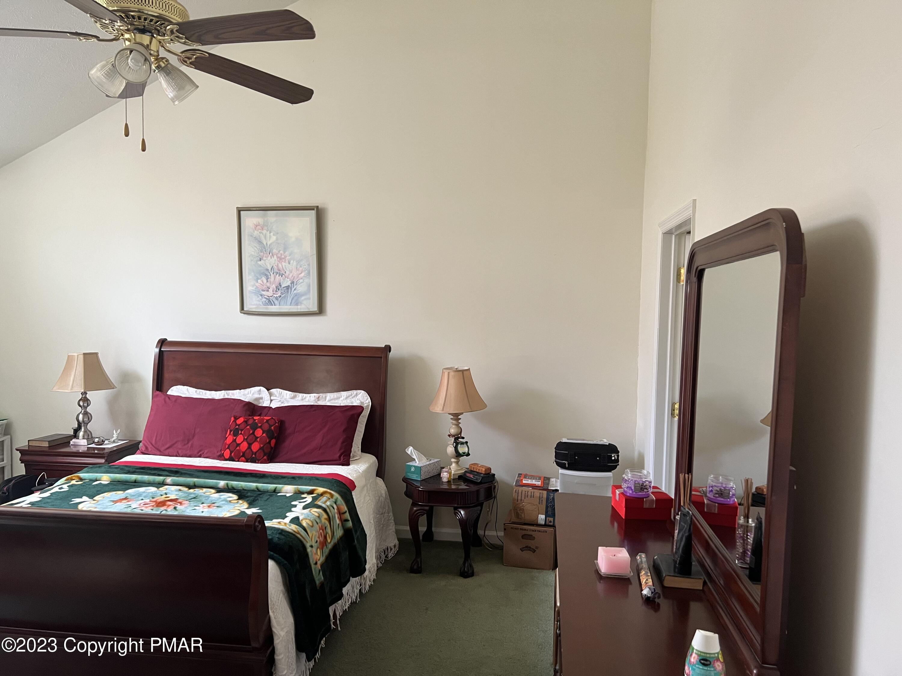 310 Coach Road Tobyhanna, PA 18466 - Photo 17 of 41 a bedroom with a bed and a mirror
