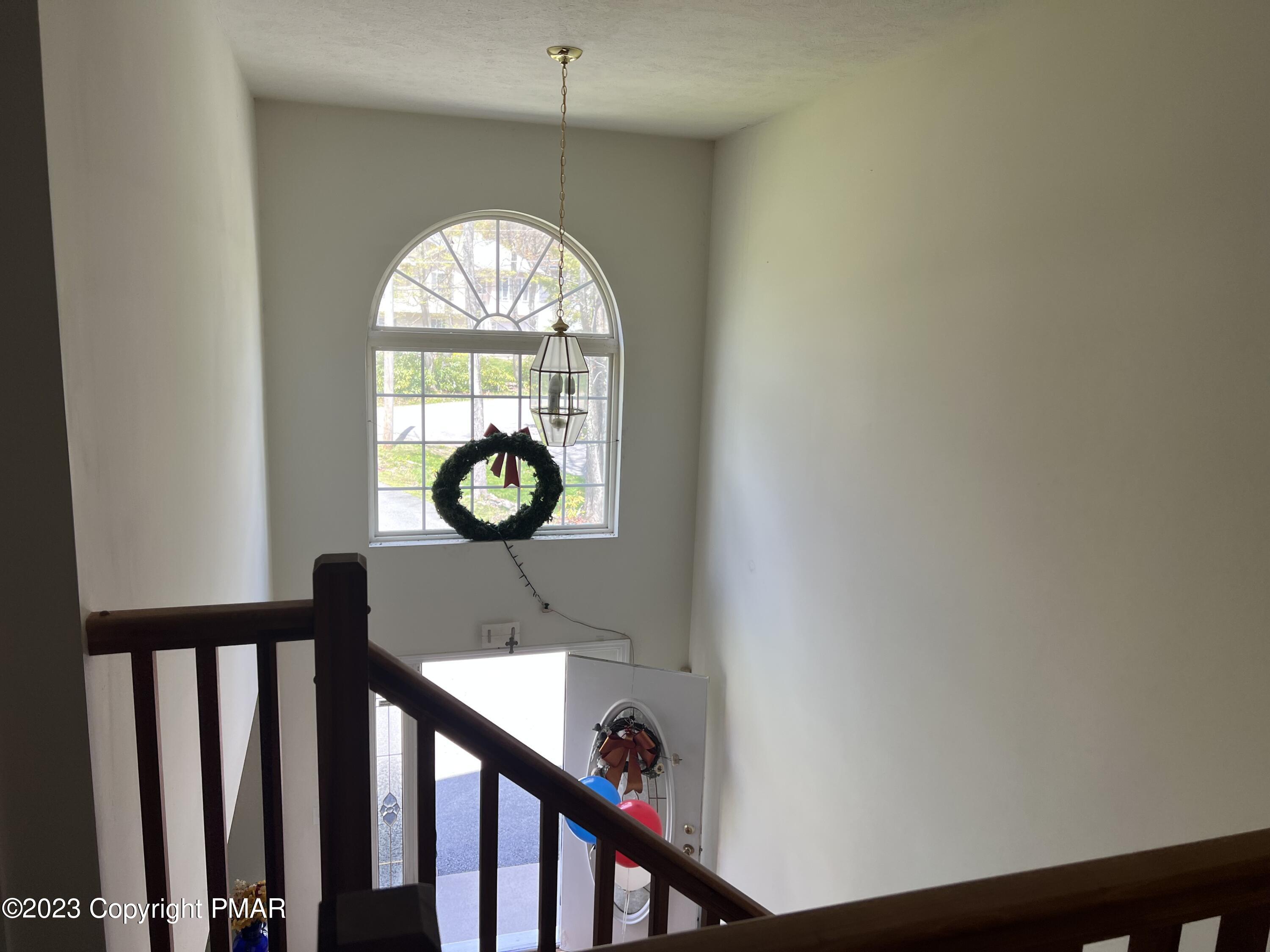 310 Coach Road Tobyhanna, PA 18466 - Photo 24 of 41 a view of a hallway with entryway wooden floor and front door