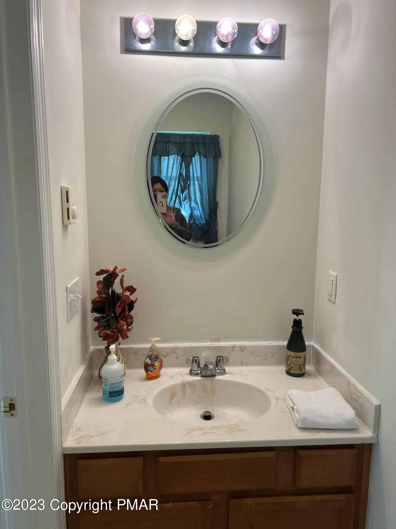 310 Coach Road Tobyhanna, PA 18466 - Photo 3 of 41 a bathroom with a sink and a mirror