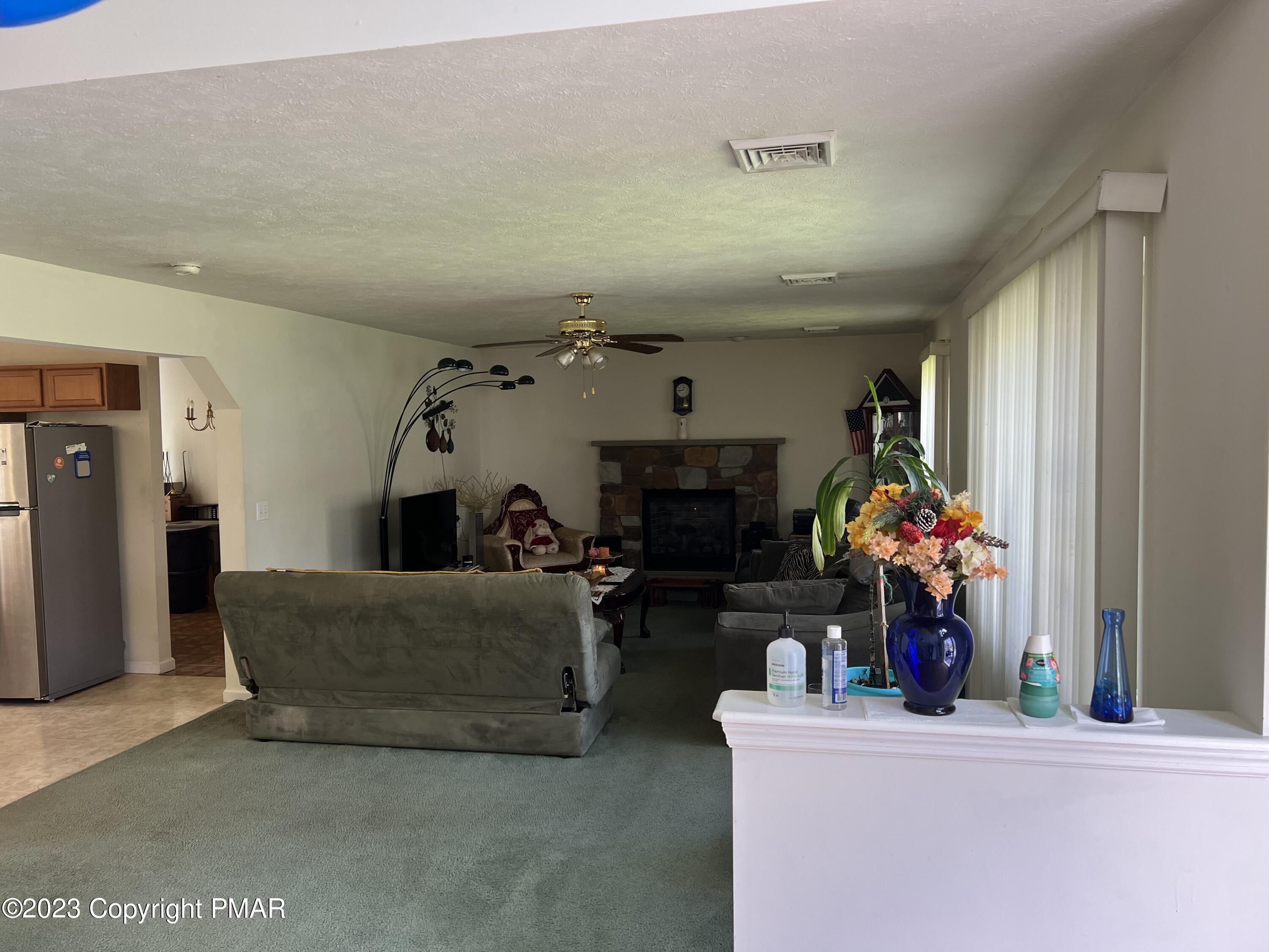 310 Coach Road Tobyhanna, PA 18466 - Photo 38 of 41 a living room with furniture and flowers