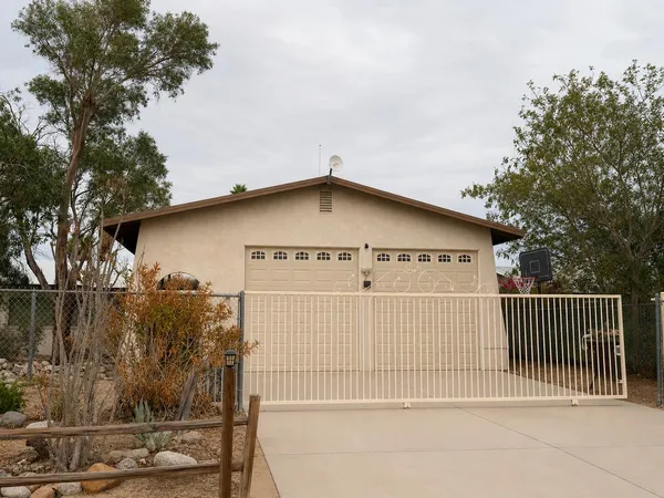 a view of a house with a iron gate