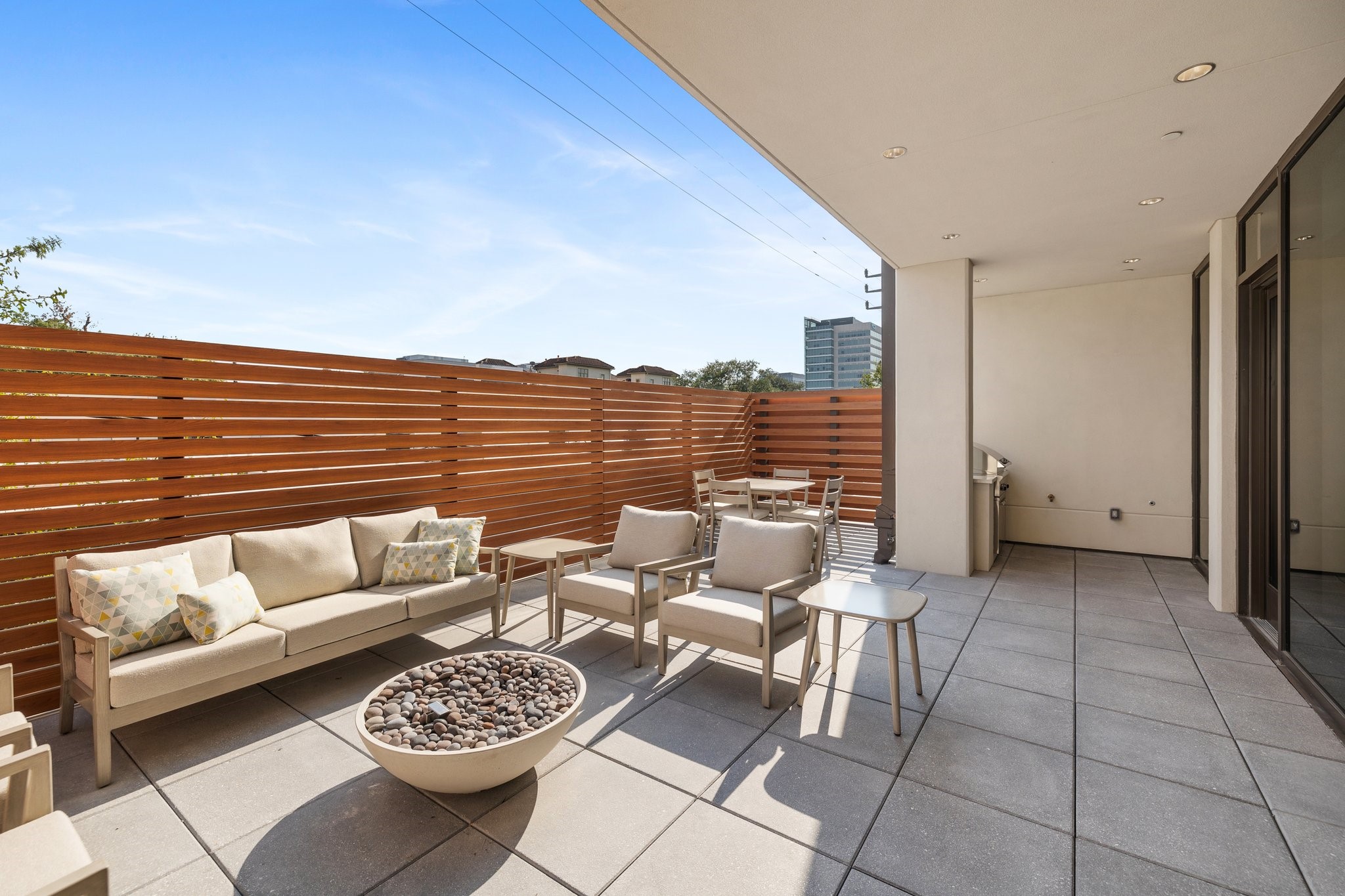2323 West Main Street, Unit 402 Houston, TX 77098 - Photo 22 of 30 The outdoor space features lounge seating with fire pit, dining area and gas grill. All amenities are on the terrace level for residents to enjoy.