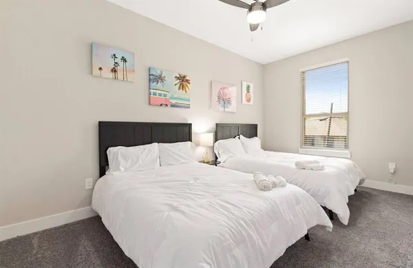 a bedroom with bed and a window
