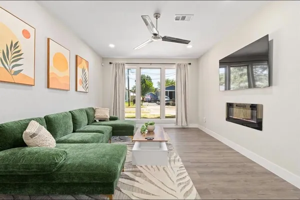a living room with furniture and a fireplace
