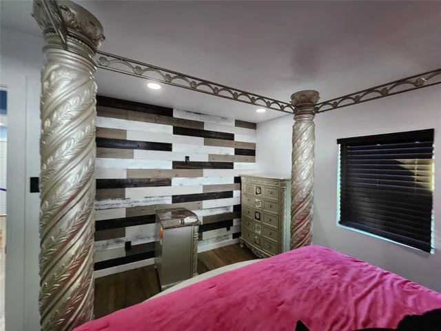 a kitchen with a refrigerator and a stove top oven