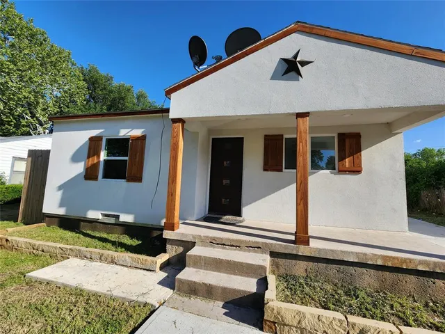 front view of a house with a street