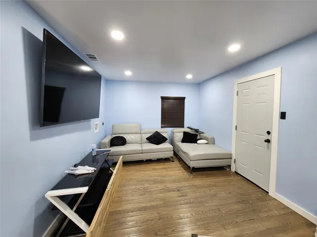 a room with furniture and a flat screen tv