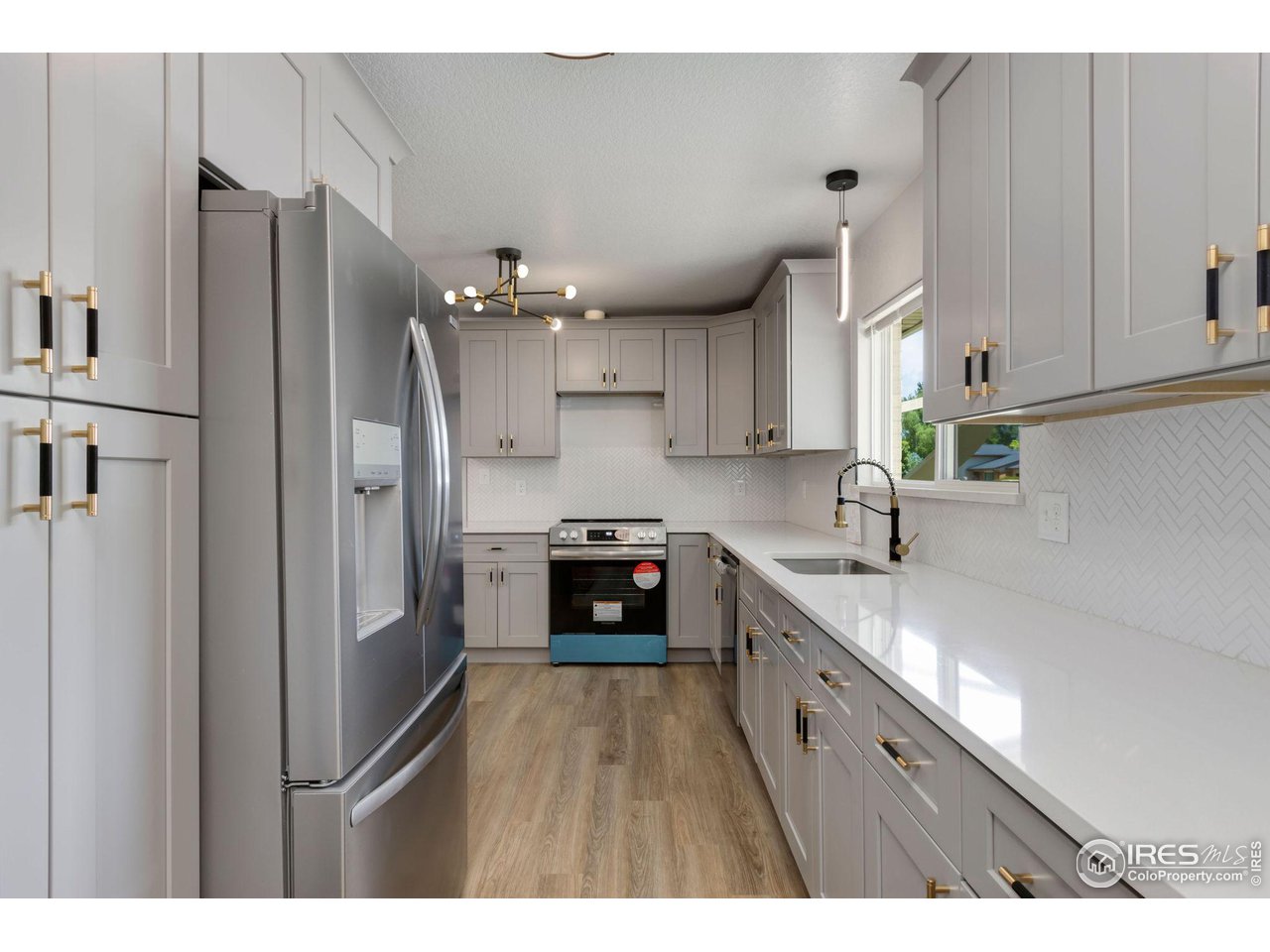 Beautiful light gray cabinets, in the updated kitchen.