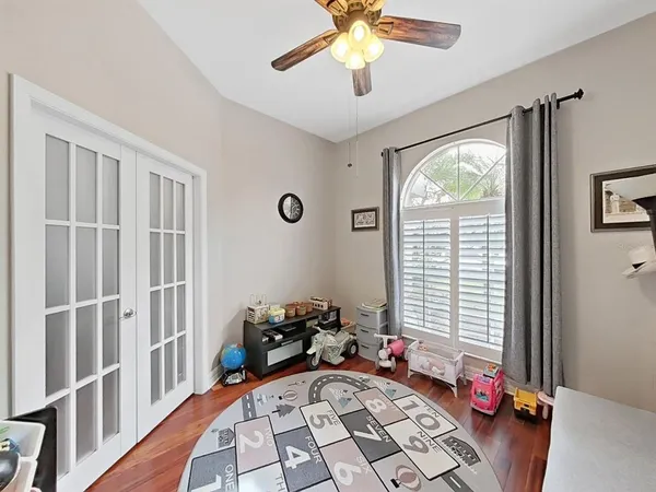 a bedroom with furniture and a window