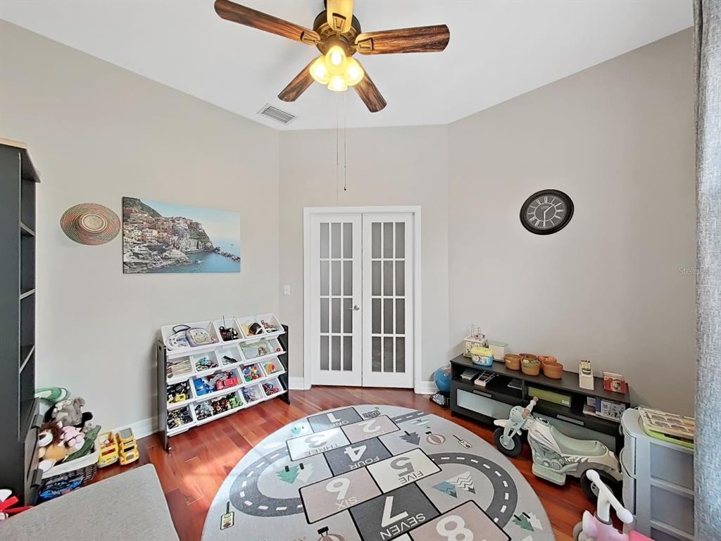 9630 Fox Hearst Road Tampa, FL 33647 - Photo 12 of 47 a bedroom with furniture and a window