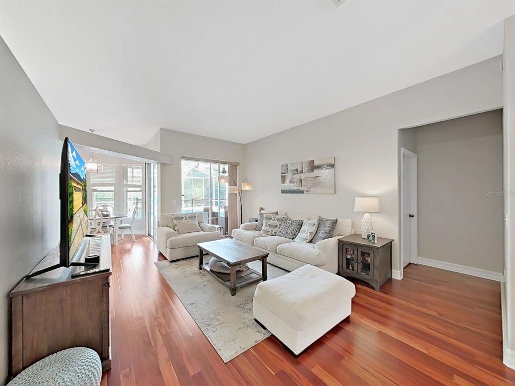 9630 Fox Hearst Road Tampa, FL 33647 - Photo 13 of 47 a living room with fireplace furniture and a flat screen tv