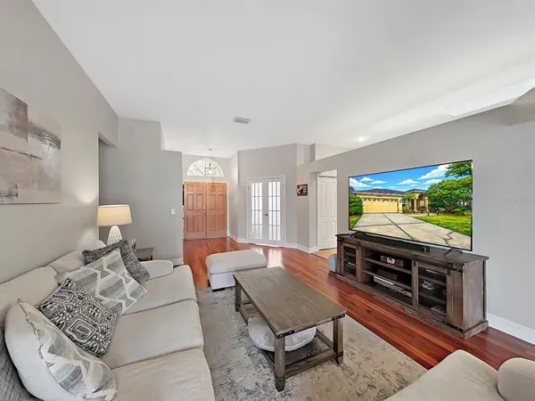 a living room with furniture and a flat screen tv