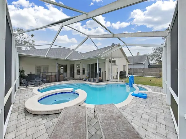 a outdoor space with swimming pool and furniture