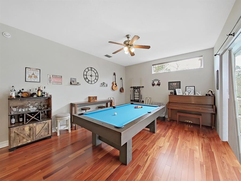 9630 Fox Hearst Road Tampa, FL 33647 - Photo 22 of 47 a living room with furniture and wooden floor
