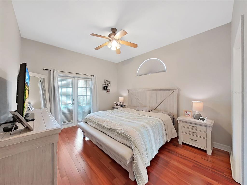 9630 Fox Hearst Road Tampa, FL 33647 - Photo 24 of 47 a bedroom with a bed and a flat screen tv