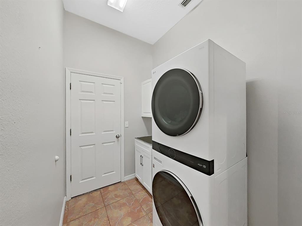 9630 Fox Hearst Road Tampa, FL 33647 - Photo 32 of 47 a view of livingroom with washer and dryer