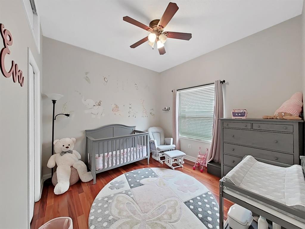 9630 Fox Hearst Road Tampa, FL 33647 - Photo 37 of 47 a bedroom with a bed and a window