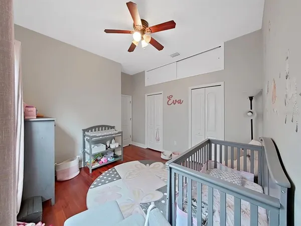 a bedroom with furniture and a chandelier