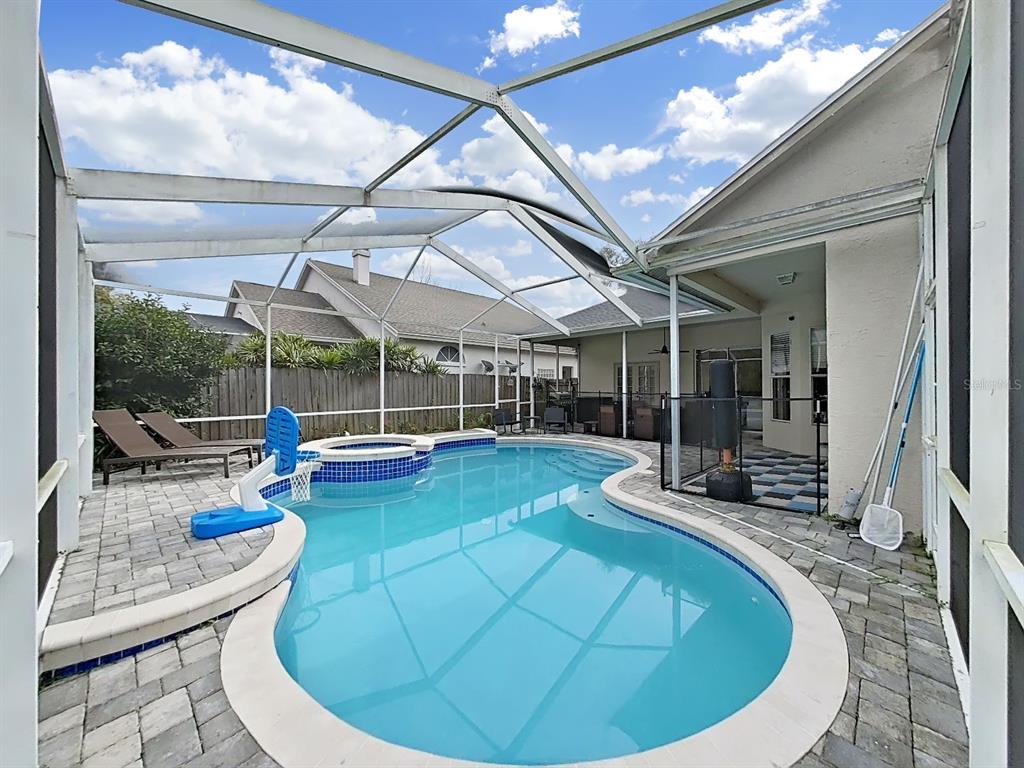 9630 Fox Hearst Road Tampa, FL 33647 - Photo 41 of 47 a view of a swimming pool with outdoor seating