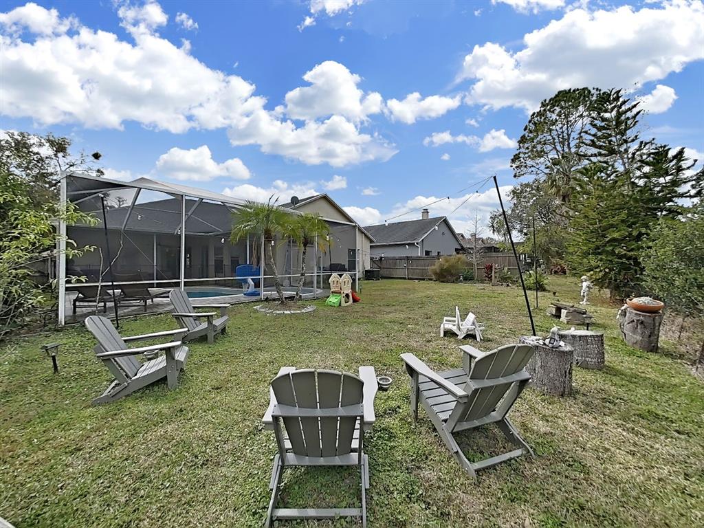 9630 Fox Hearst Road Tampa, FL 33647 - Photo 44 of 47 a view of a garden with furniture
