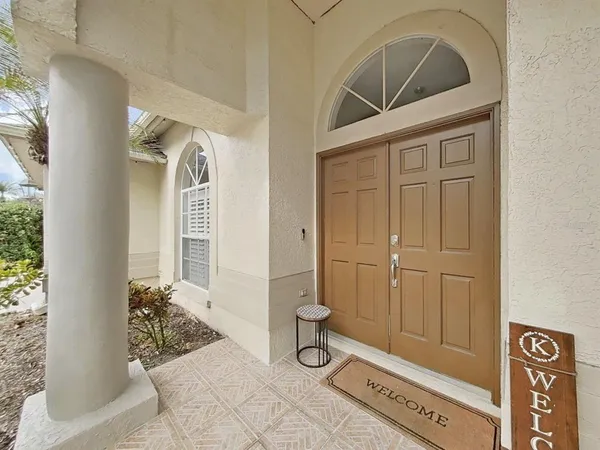 a view of front door and bedroom
