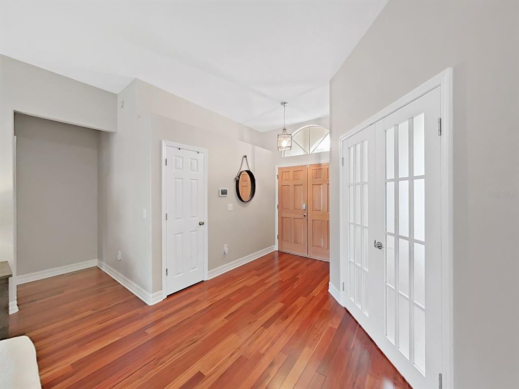 9630 Fox Hearst Road Tampa, FL 33647 - Photo 9 of 47 a view of a hallway with wooden floor