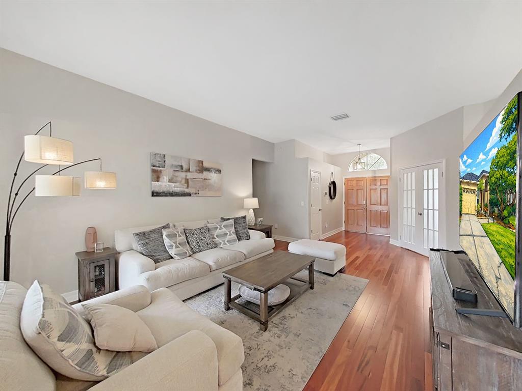 9630 Fox Hearst Road Tampa, FL 33647 - Photo 10 of 47 a living room with furniture and a wooden floor
