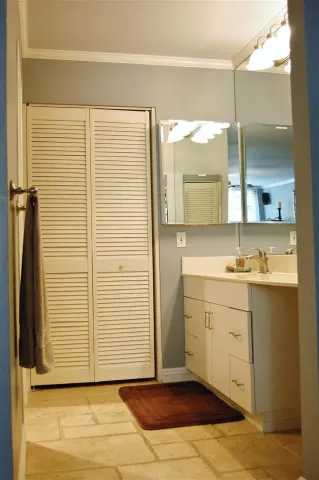 a bathroom with a sink a mirror and a shower